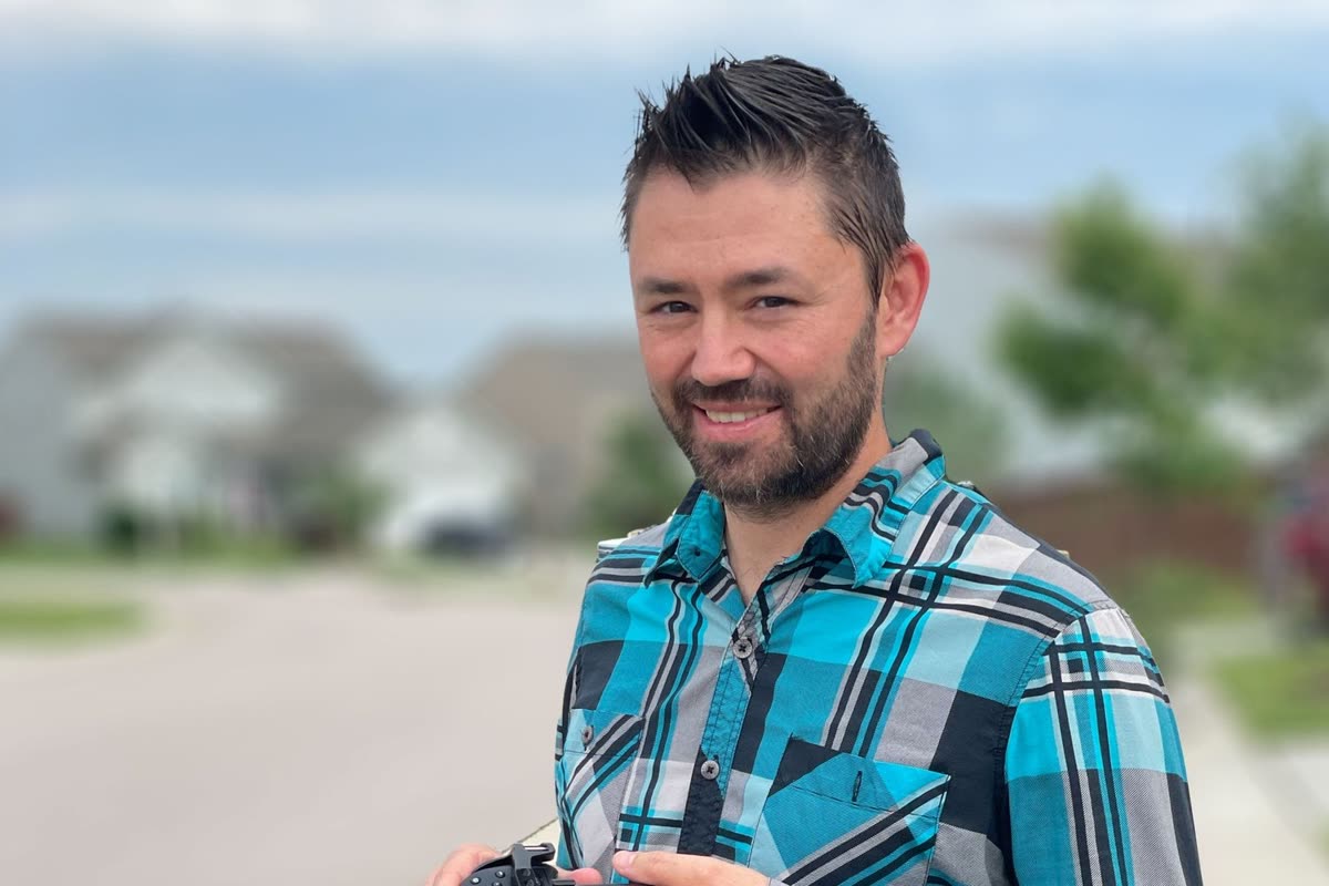 Paul-Thomas L. Parnell holding a camera
